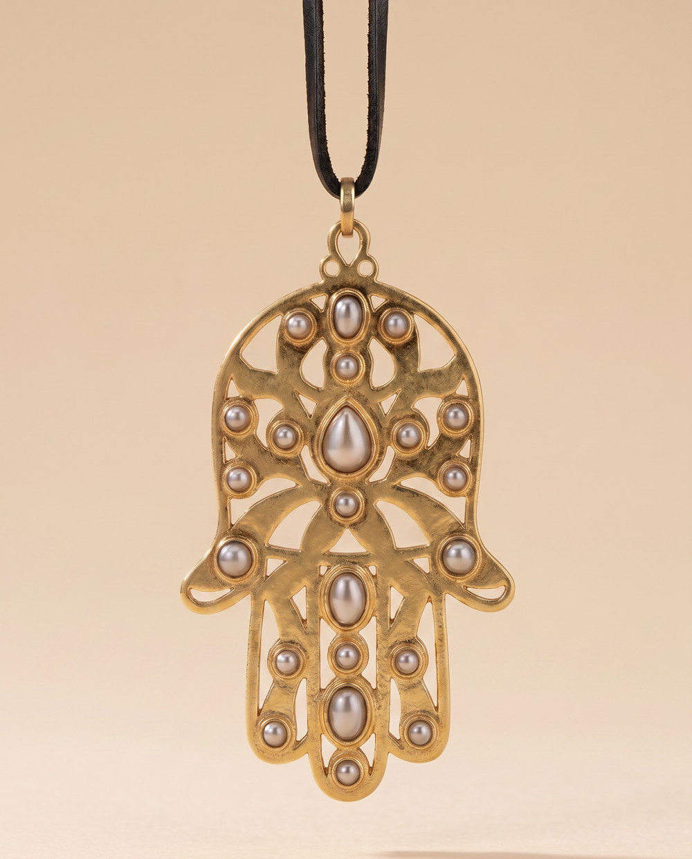 Tay Silver & Gold Hamsa pendant on leather strap by Tay from Marina St Barth